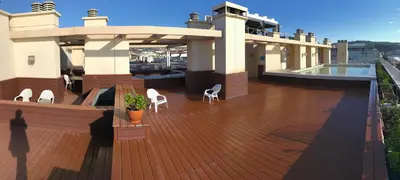 a deck with chairs and a pool on a house at Royal Promenade in Nice