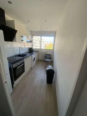 a small kitchen with a sink and a stove at Proche promenade des anglais in Nice