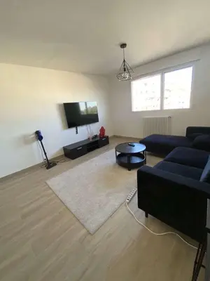 a living room with a couch and a flat screen tv at Proche promenade des anglais in Nice