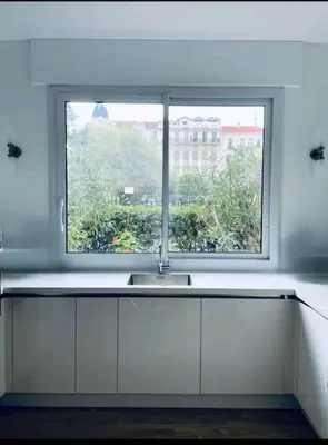 a kitchen with a sink and a window at Luxueux appartement, Carré d'Or, Square Mozart in Nice