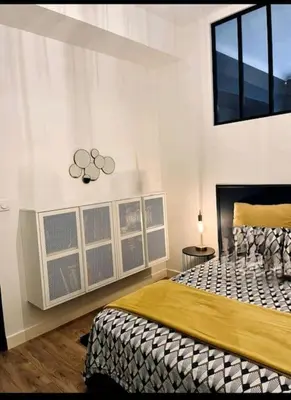 a bedroom with a large bed in a room at Luxueux appartement, Carré d'Or, Square Mozart in Nice