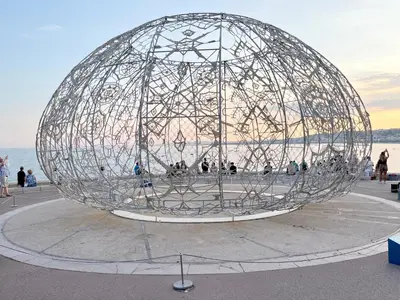 a large metal sphere with people inside of it at Shared Duplex Apartment Nice-Port in Nice