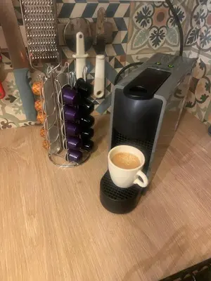 a coffee maker with a cup of coffee on a table at Pause et Sérénité Studio de 28m2 in Cagnes-sur-Mer