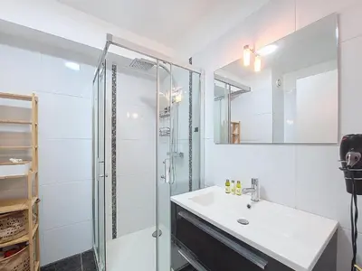 a white bathroom with a sink and a shower at Nestor&Jeeves - KALLISTA - Central - Balcony in Nice