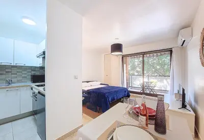 a kitchen and a bedroom with a bed in a room at Nestor&Jeeves - KALLISTA - Central - Balcony in Nice