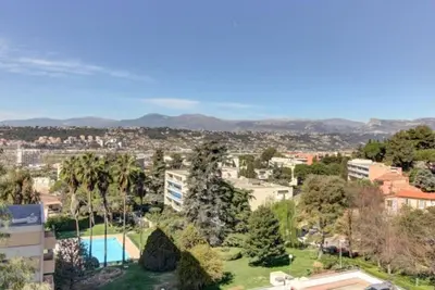 an apartment with a view of a city at Terrasses de la Corniche, 2p 65m2 spacieux, terrasses mer & montagne, piscine et parking privé in Nice