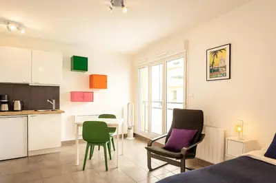 a room with a kitchen and a table and chairs at Ma place au sud Nice 607 in Nice