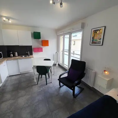 a room with a kitchen and a table and chairs at Ma place au sud Nice 607 in Nice