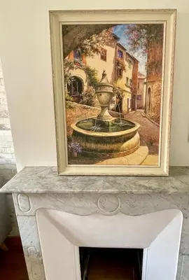 a painting of a fountain on top of a table at Spacieux appartement à Nice in Nice