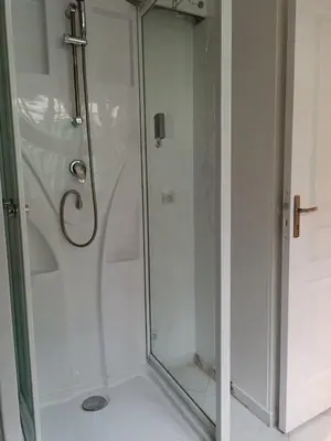 a kitchen with a white refrigerator and a tile floor at Studio Dauphiné in Nice