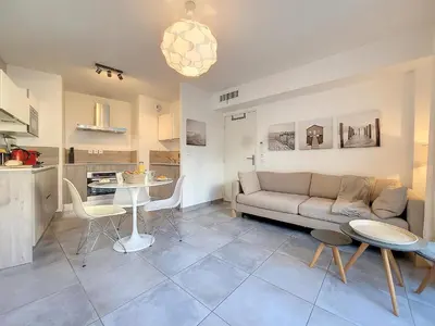 a living room with a couch and a table at Nestor&Jeeves - FRESCO - Central - Very close sea - Balcony in Nice