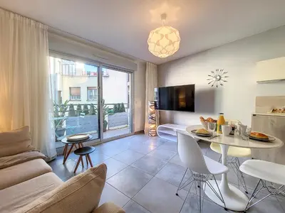 a living room with a couch and a table at Nestor&Jeeves - FRESCO - Central - Very close sea - Balcony in Nice
