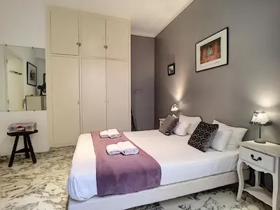 a bedroom with a bed with two towels on it at Nestor&Jeeves - NOE - Central - Close sea - Spacious in Nice
