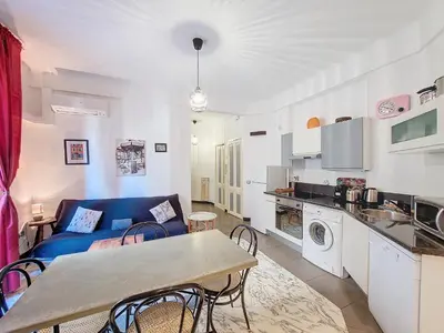 a living room with a blue couch and a table at Nestor&Jeeves - NOE - Central - Close sea - Spacious in Nice