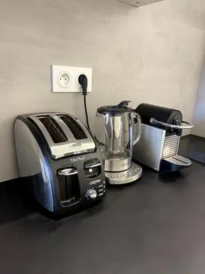 a toaster and a blender sitting on a counter at Studio au coeur du Vieux Nice - Vue mer et clocher in Nice