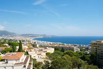 a view of the city and the ocean at Nice Renting - ABBAYE - Luxury Penthouse Sea View Pool Tennis Parking in Nice