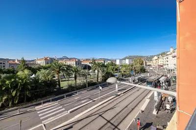 a view of a city street with palm trees and buildings at 2 Bdr Panoramic View on Gardens in Nice