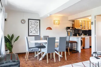a kitchen and dining room with a table and chairs at 2 Bdr Panoramic View on Gardens in Nice