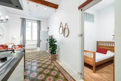 a living room with a couch and a bed at 2 Bdr with Independent Studio - Old Town in Nice