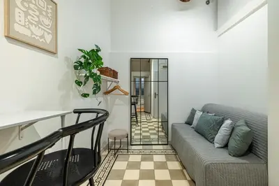 a living room with a couch and a table at 2 Bdr with Independent Studio - Old Town in Nice