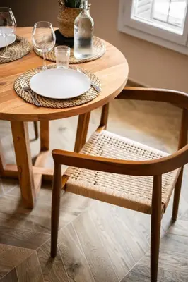 a wooden table and chair with a plate on it at La Suite Lascaris PORT of NICE #renovated in Nice
