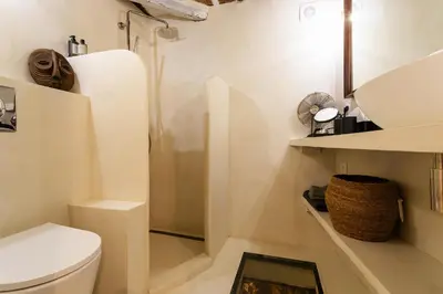 a bathroom with a toilet and a sink at LA CASETTA DI AZZURRA AP4427 By Riviera Holiday Homes in Villefranche-sur-Mer