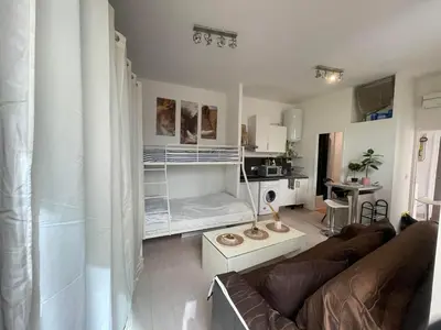 a living room with a couch and a bunk bed at Charmant loft HyperCentre in Nice