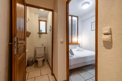 a small bathroom with a bed and a toilet at 2 Bdr Heart Old Town Nice in Nice