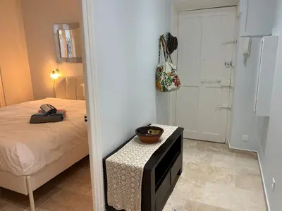 a bedroom with a bed and a tv on a table at Rossetti Rosa Vieux Nice 2 bed in Nice