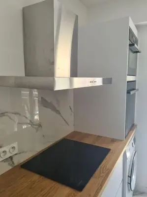 a kitchen with a stainless steel stove top oven at Superbe Appartement Luxueux Spacieux 50 m2 Port Nice in Nice