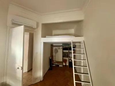 a room with a staircase with a bed in it at Appartement Nice centre ville gare in Nice