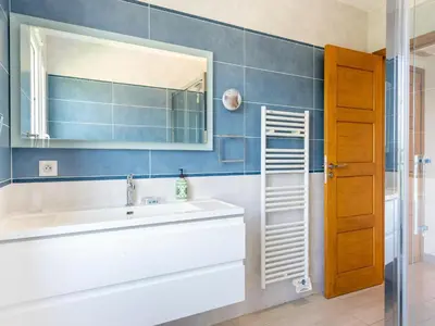 a bathroom with a sink and a mirror at CASA-Mathilda luxueuse villa moderne avec piscine in La Gaude