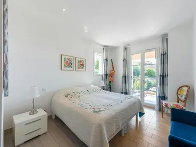 a white bedroom with a bed and a window at CASA-Mathilda luxueuse villa moderne avec piscine in La Gaude