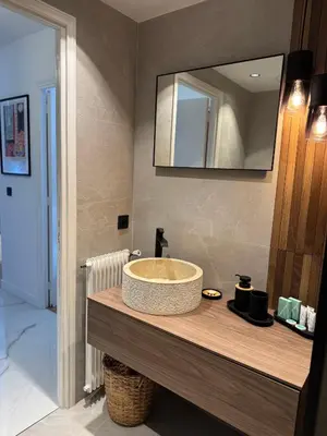 a bathroom with a sink and a mirror at Residence Butterfly in Nice