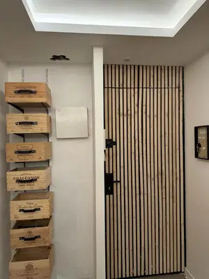 a room with boxes on the wall next to a door at APPARTEMENt COSY in Nice