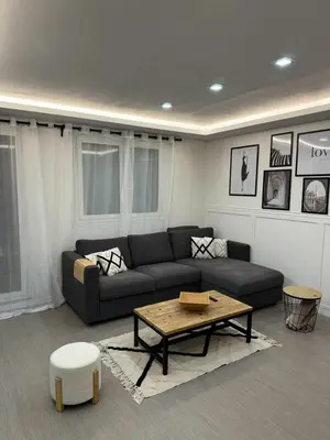 a living room with a couch and a coffee table at APPARTEMENt COSY in Nice