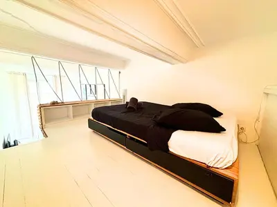 a bedroom with a bed in a white room at Cosy appart 4pers vieux Nice in Nice