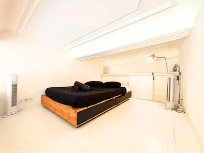 a bedroom with a bed in a white room at Cosy appart 4pers vieux Nice in Nice