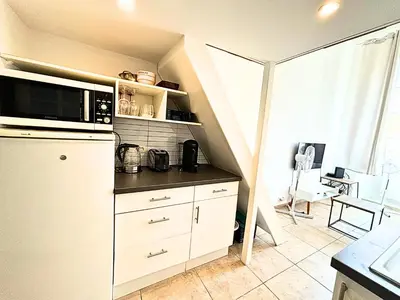 a kitchen with a white refrigerator and a microwave at Cosy appart 4pers vieux Nice in Nice