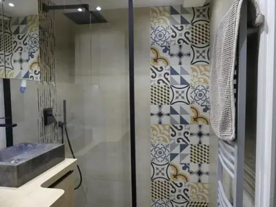 a bathroom with a shower and a sink at 68 m2 central pour des vacances en famille in Nice