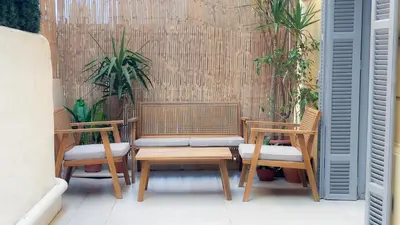two chairs and a table on a patio at Central Studio - Bright & Modern - Private Terrace - AirCon - Near Train & Beach in Nice