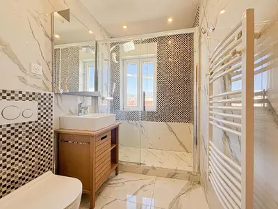 a bathroom with a sink and a shower at Suite Zara - wifi, AC, 4 pers in Nice