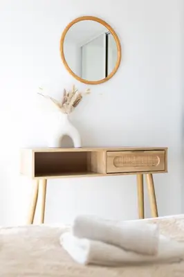 a dressing table with a mirror and a bed at Vue mer sublime, terrasse ensoleillée et parking in Nice