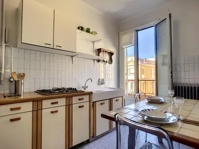 a kitchen with a table and a counter top at Nestor&Jeeves - COTE PIETONNE - Central - By sea - Pedestrian zone in Nice