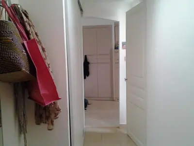 a hallway with a white door and a closet at Chambre Nice hyper centre ville in Nice