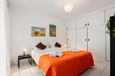 a bedroom with a bed with two towels on it at Suite Prestige FSHH in Nice