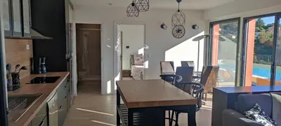 a kitchen and living room with a table and a dining room at T2 vue imprenable au calme in Nice