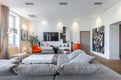 a living room with a couch and a table at Le Massena in Nice