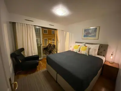 a hotel room with a bed and a chair at Le Grand Palais de la Méditerranée Beach Access Apartments - Top Choice In Nice in Nice
