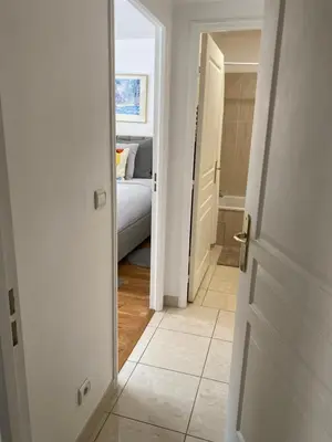 an open door to a bedroom with a bed at Le Grand Palais de la Méditerranée Beach Access Apartments - Top Choice In Nice in Nice